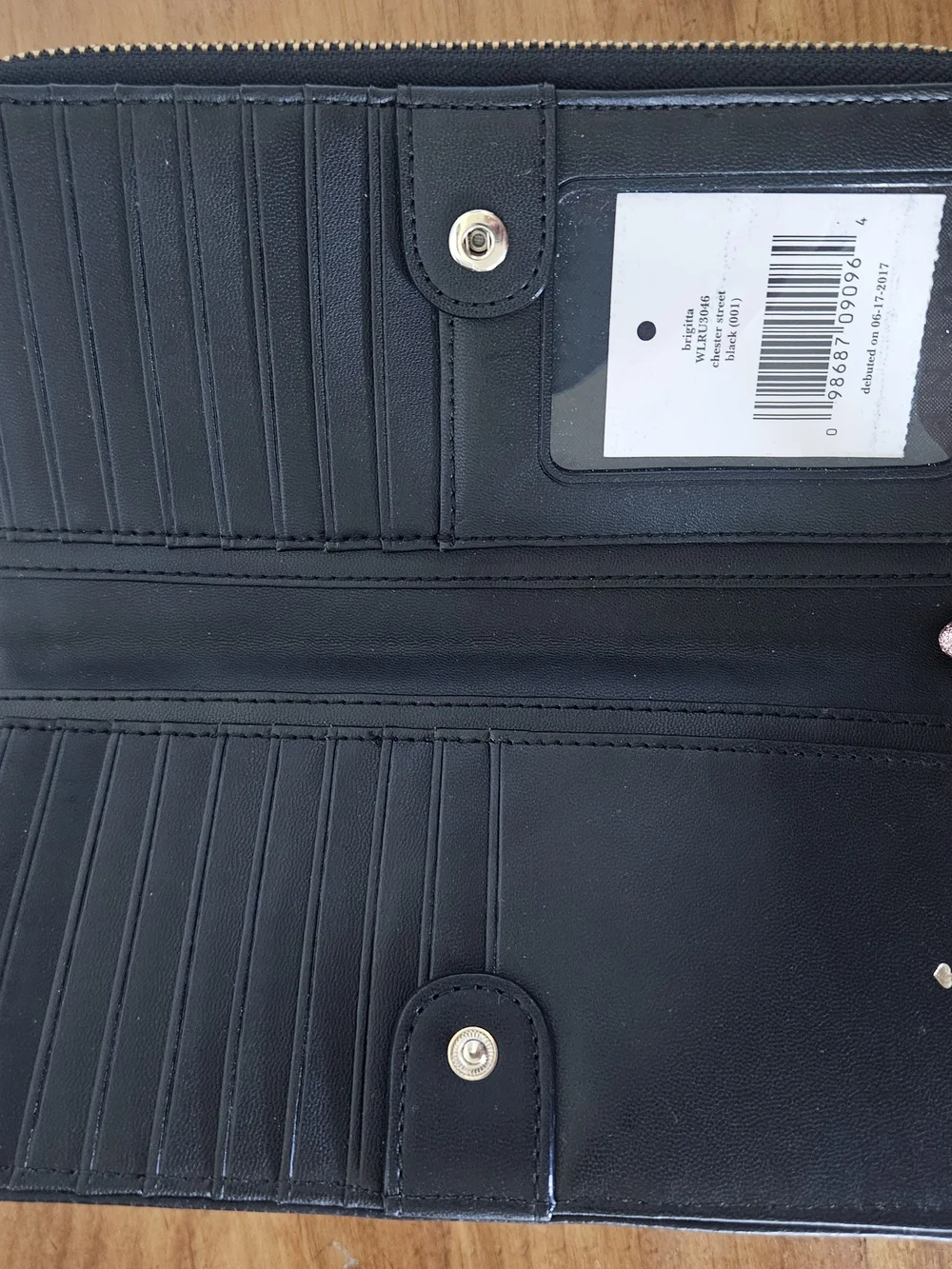 kate spade black pebbled leather wristlet clutch with gold logo